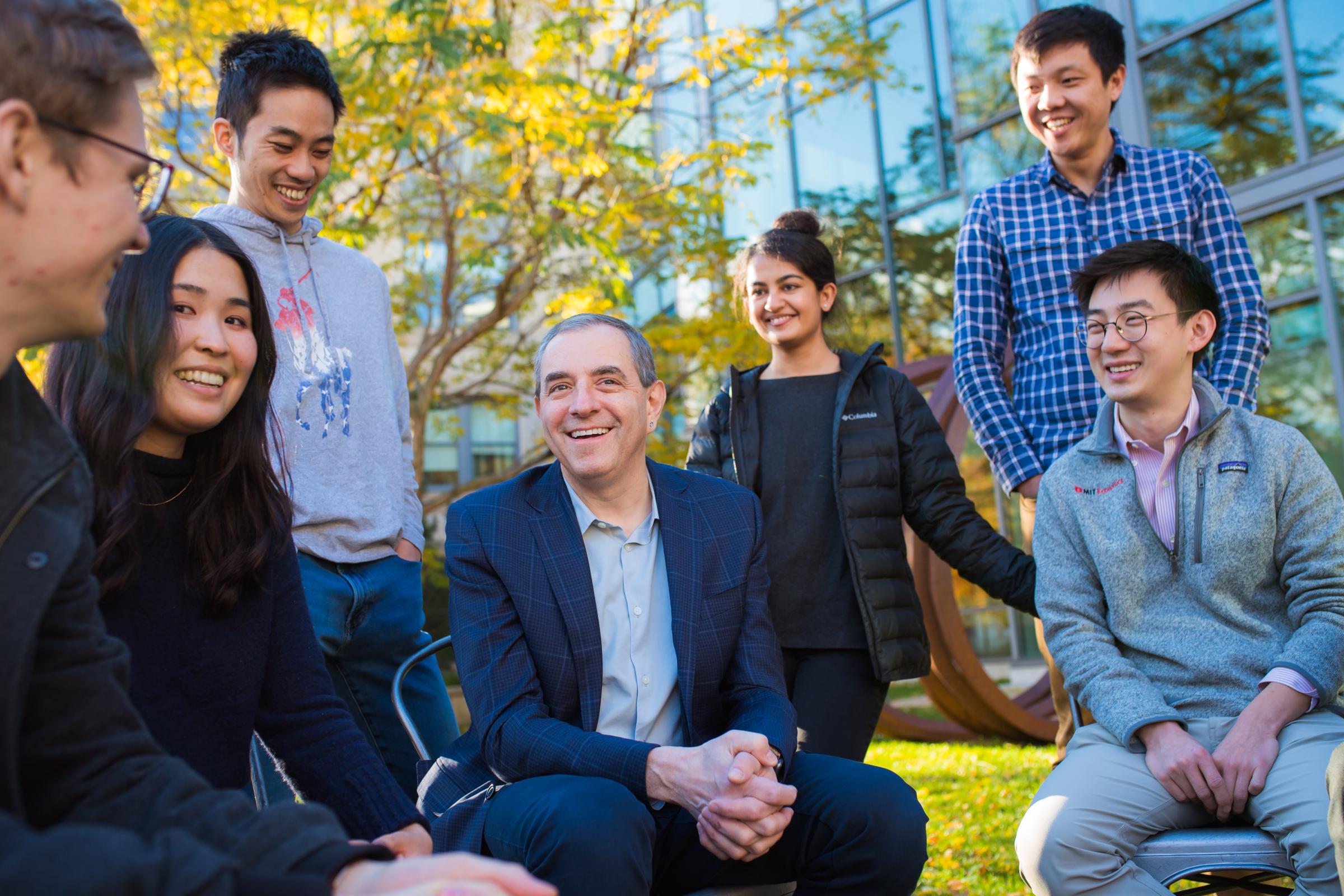 David Autor with students at Committed to Caring event photo shoot